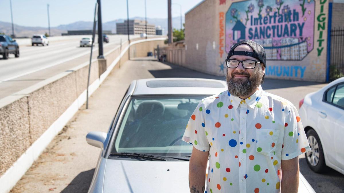 Brad Stephens stands by his car at Interfaith Sanctuary, a homeless shelter in Boise. Stephens has been living at Interfaith since February. He was forced out of his home in Caldwell in July 2020, shortly after he was laid off during the pandemic.