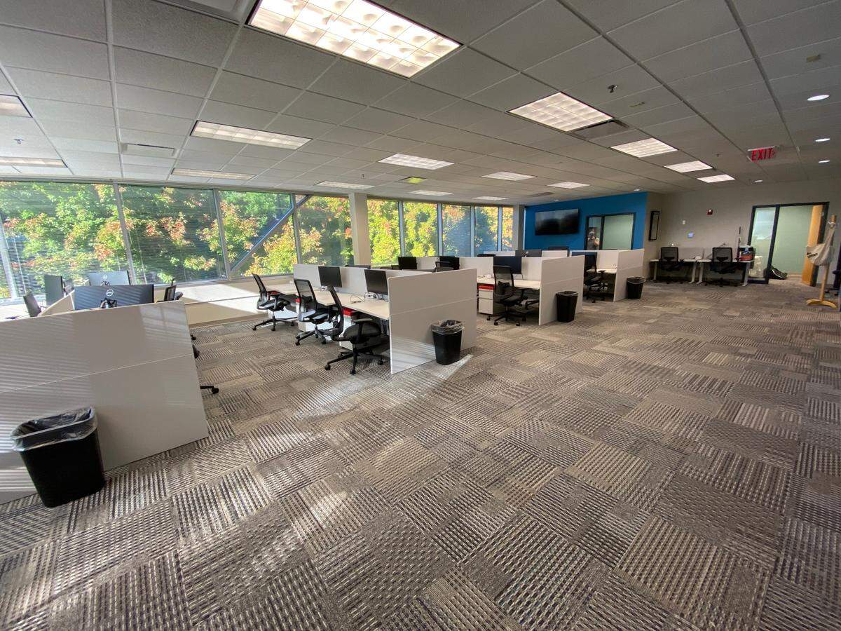 The Idaho Statesman’s new office space includes blue and green accent walls, as well as plentiful trees outside the windows.