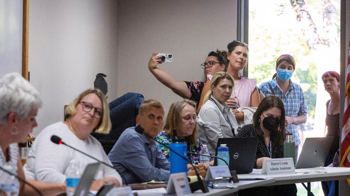People stood in doorways to attend a crowded meeting of the Meridian Library District’s board of trustees on Aug. 17, 2022, with some criticizing libraries over books containing nudity or depictions of sex. A new Idaho bill would allow parents to sue schools and libraries that allow minors to obtain materials with sexual content.