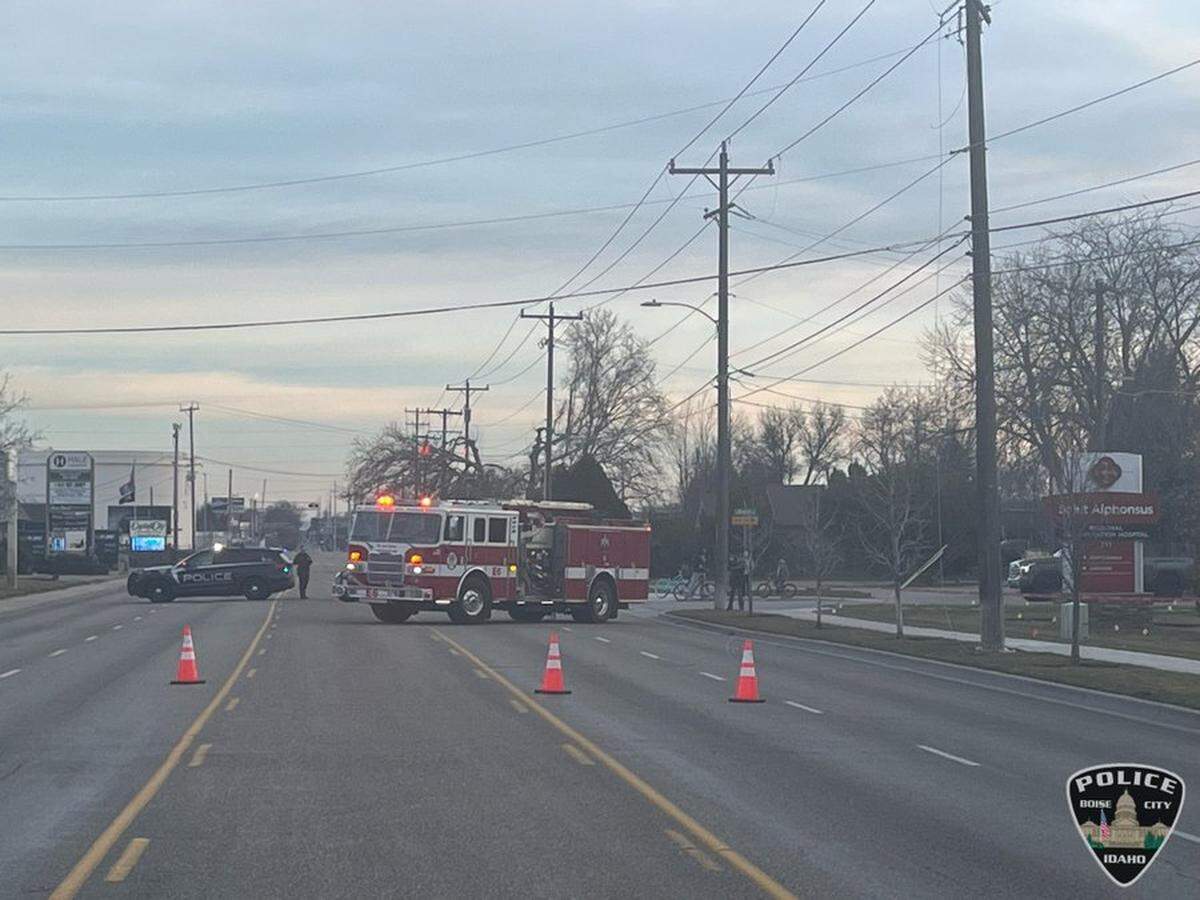Crews work to fix a downed power line on Curtis Road in Boise.