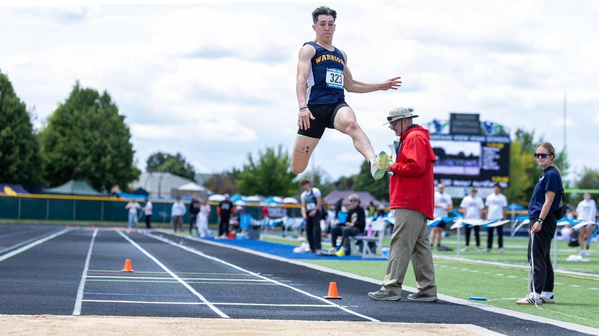 Meridian’s Carver Martin competes in the 6A boys long jump. Martin won the event with a jump of 22-10.75.