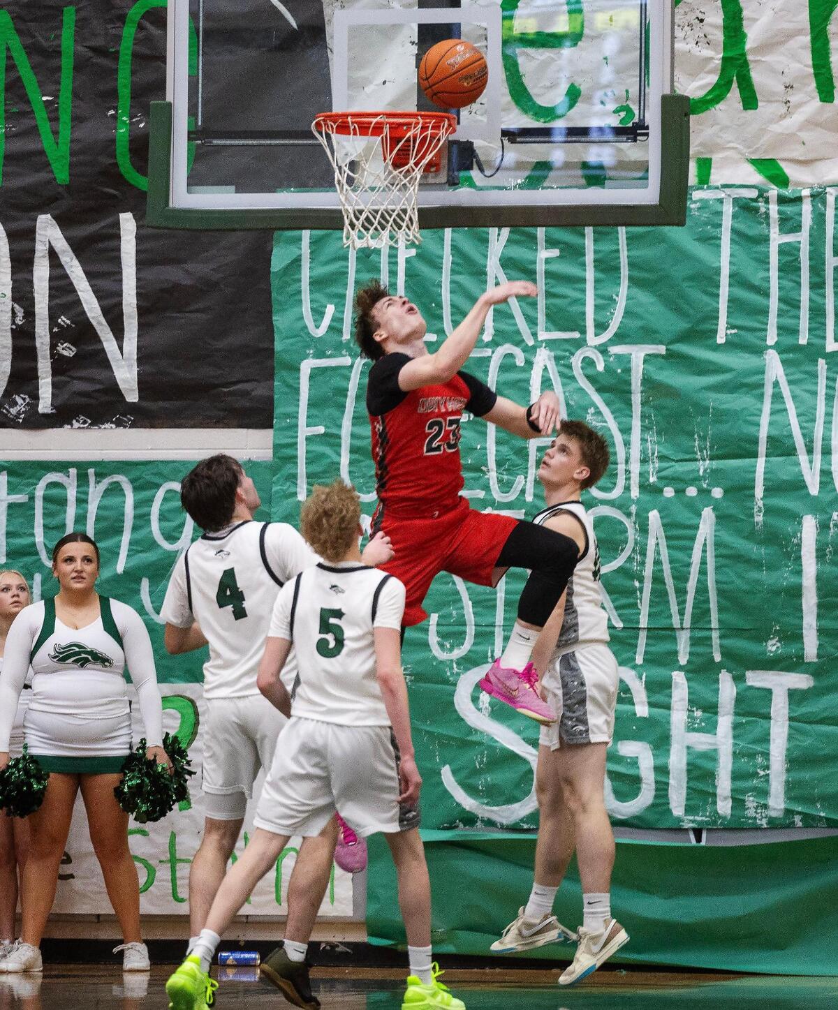 Eagle defenders watch as Owyhee senior Boden Howell scores two of his game-high 19 points in a 58-35 victory Thursday.