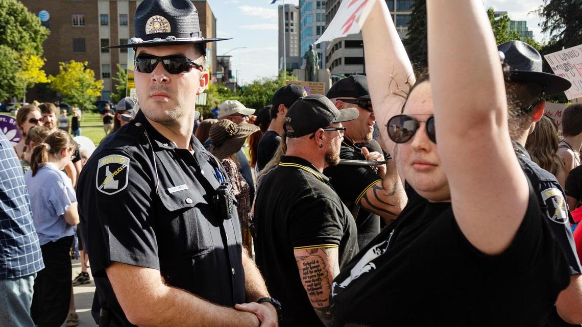 Idaho State Police form a line between those attending a pro-life celebration and protesters who came to support abortion rights at the Idaho Statehouse in Boise in this June file photo.