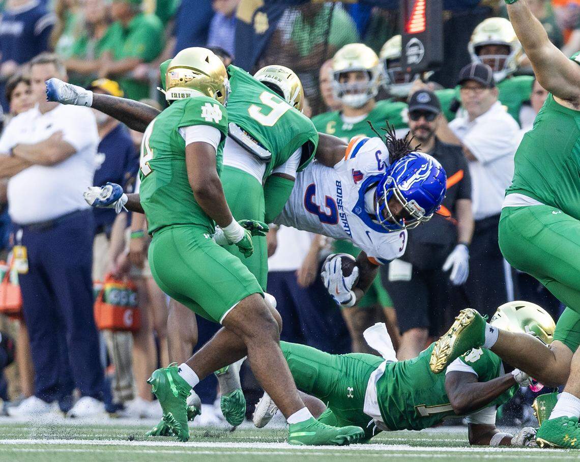 Boise State wide receiver Latrell Caples holds onto the football after a catch and hard tackle by Notre Dame safety Tae Johnson in South Bend, Ind., Saturday, Oct. 4, 2025.