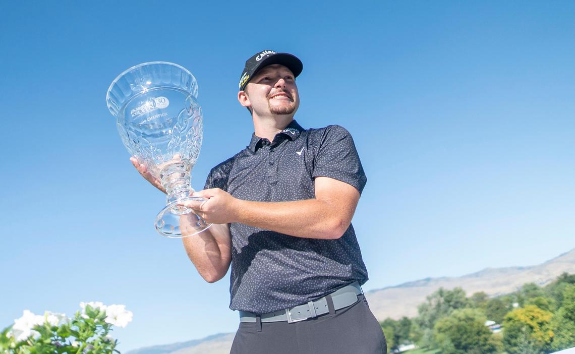 Matthew NeSmith holds the championship cup as he celebrates his Albertsons Boise Open victory Sunday at Hillcrest Country Club. NeSmith shot 64 to finish in first place at 19-under for the tournament.