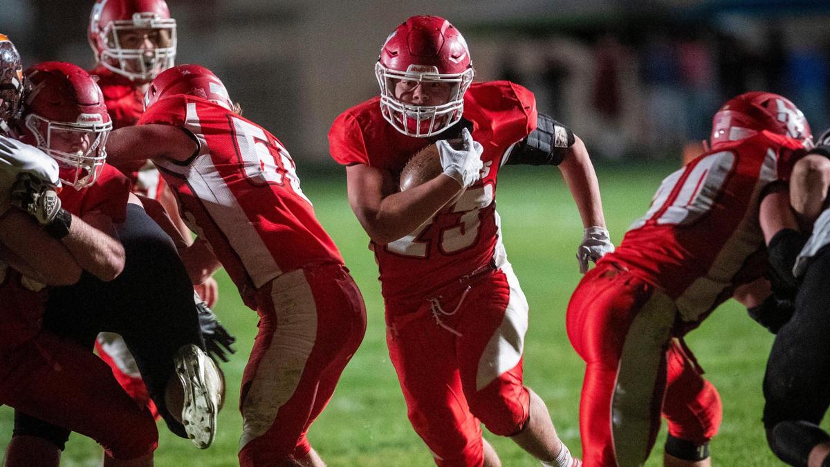 Homedale's offensive line clears a big hole for Hayden Kincheloe to run through Oct. 23 against Fruitland. 