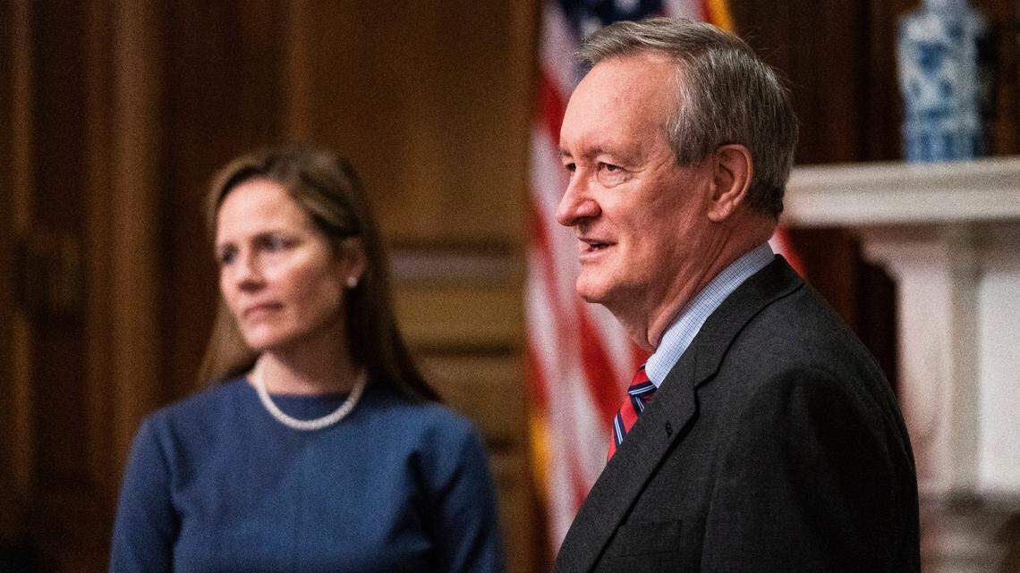 Judge Amy Coney Barrett, President Donald Trump’s nominee to the Supreme Court, left, meets with Sen. Mike Crapo, R-Idaho, at the Capitol on Tuesday, Sept. 29, 2020, in Washington.