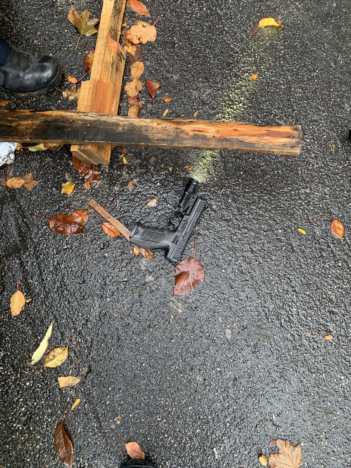 A gun lies outside after the Boise Towne Square Mall shooting in October 2021.