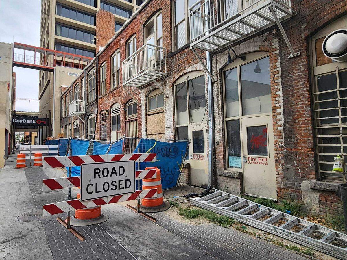 Road closed signs block off the alleyway behind the Union Block building.