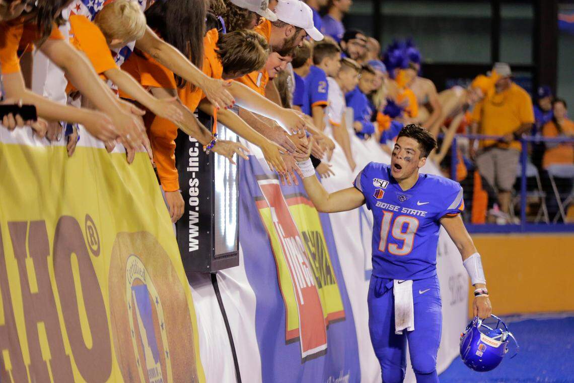 Boise State quarterback Hank Bachmeier high-fives fans after the Broncos’ 14-7 win against Marshall on Sept. 6, 2019. Bachmeier spoke to the media for the first time Tuesday.
