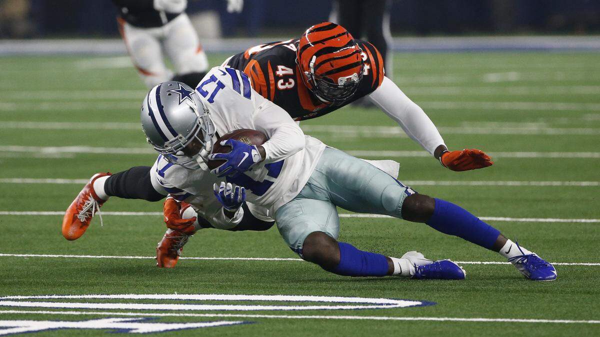 Dallas Cowboys wide receiver Allen Hurns (17) makes a catch in front of Cincinnati Bengals defensive back George Iloka (43) during the first half of a preseason NFL football game in Arlington, Texas, Saturday, Aug. 18, 2018. (AP Photo/Michael Ainsworth)