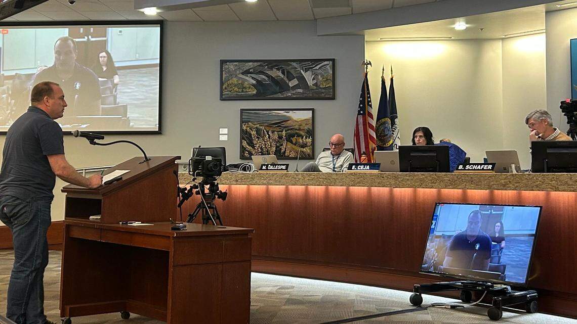 Dan Everhart, at left, has led much of the charge against recent plans to shift the number of residential units at the proposed ICCU Towers. Commissioners in this picture, from left to right, include Milt Gillespie, Ester Ceja and Bob Schafer.
