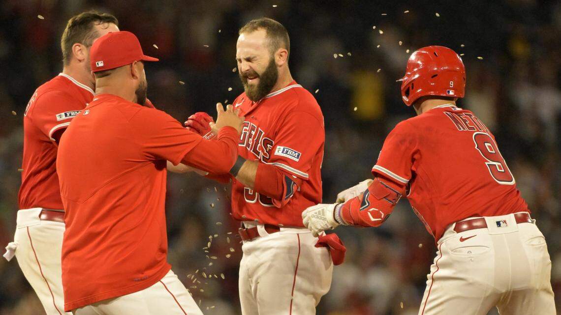 Boise native Michael Stefanic, center, celebrates with his Los Angeles Angels teammates after hitting an extra-inning, walk-off single Monday to beat the Yankees.