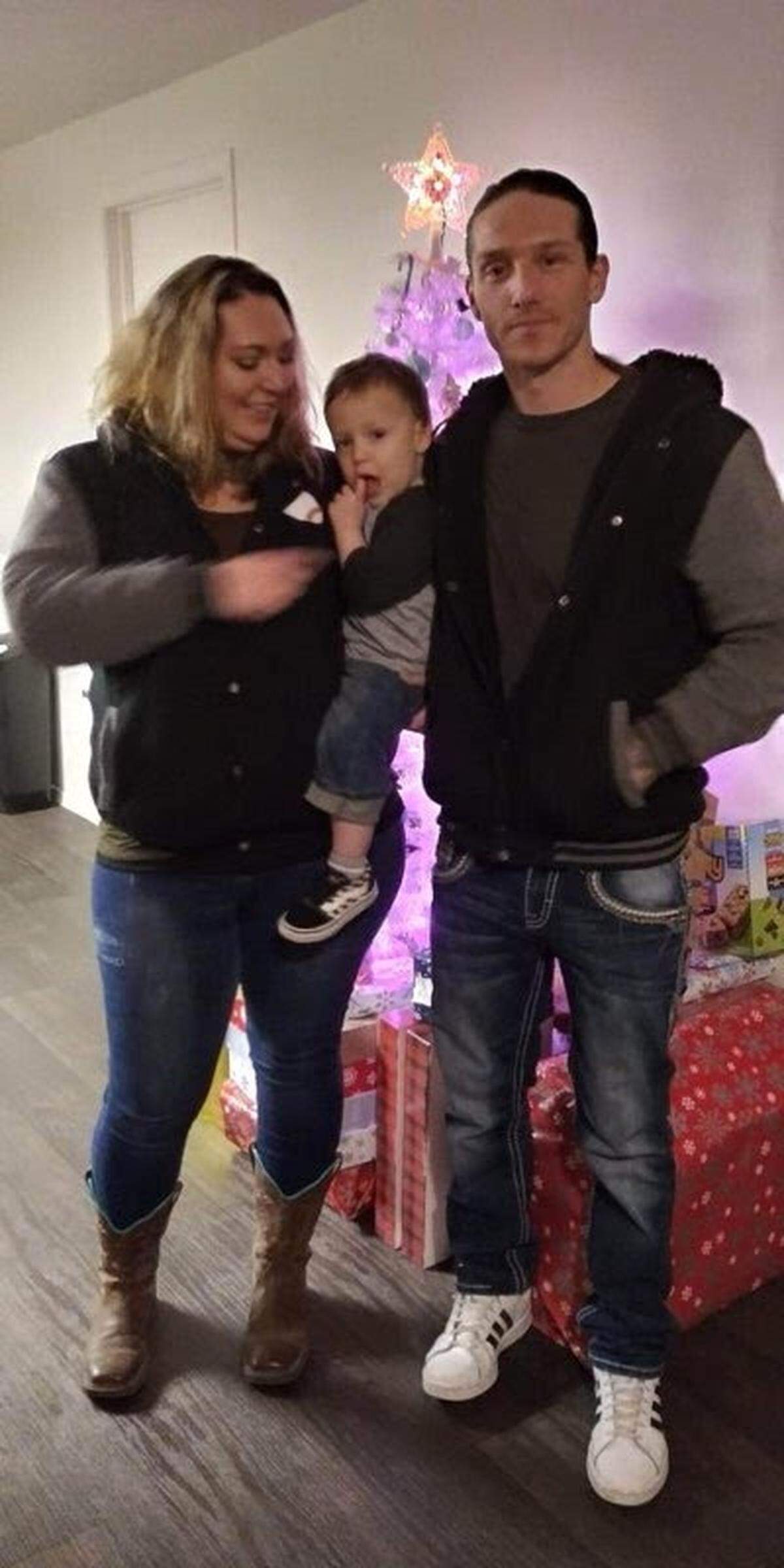 Tim Riley is seen with his wife, Paula, and son.