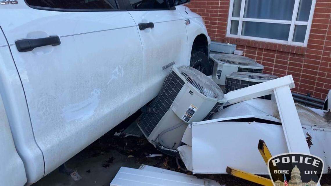 A 39-year-old man was arrested Friday on multiple charges after he allegedly drove his car into a building and shot at police.