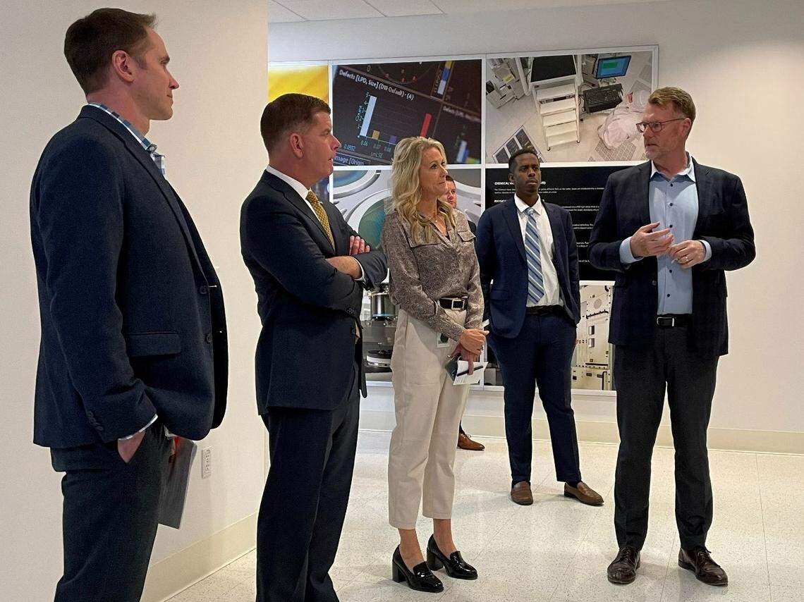 From left: Scott Gatzemeier, Micron’s chief vice president of U.S. expansion; U.S. Secretary of Labor Marty Walsh; April Arnzen, senior vice president and chief people officer for Micron; and Scott J. DeBoer, executive vice president of technology and products, tour Micron’s Southeast Boise headquarters on Tuesday.