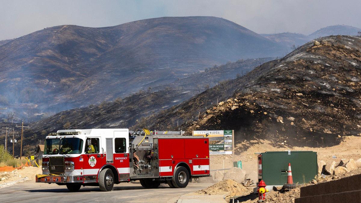 The Boise Foothills smolder from the Valley Fire, seen from Harris Ranch on Friday.