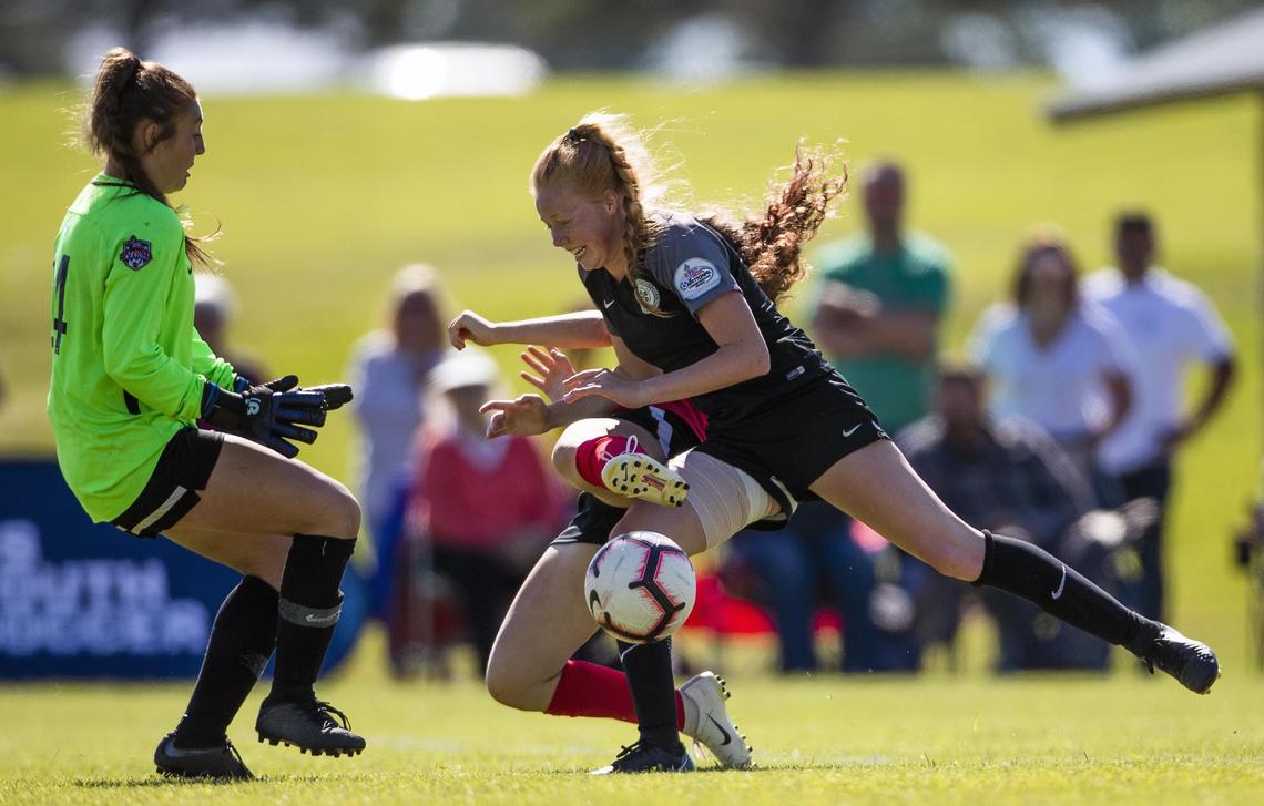 Boise Thorns’ Hayden Wilsey collides with Utah Celtic FC’s Ellie Ford, right, at she tries to shoot around keeper Brooklyn Northcutt during the girls U-15 Far West Regional championship match Sunday, June 23, 2019 at Simplot Sports Complex in East Boise.