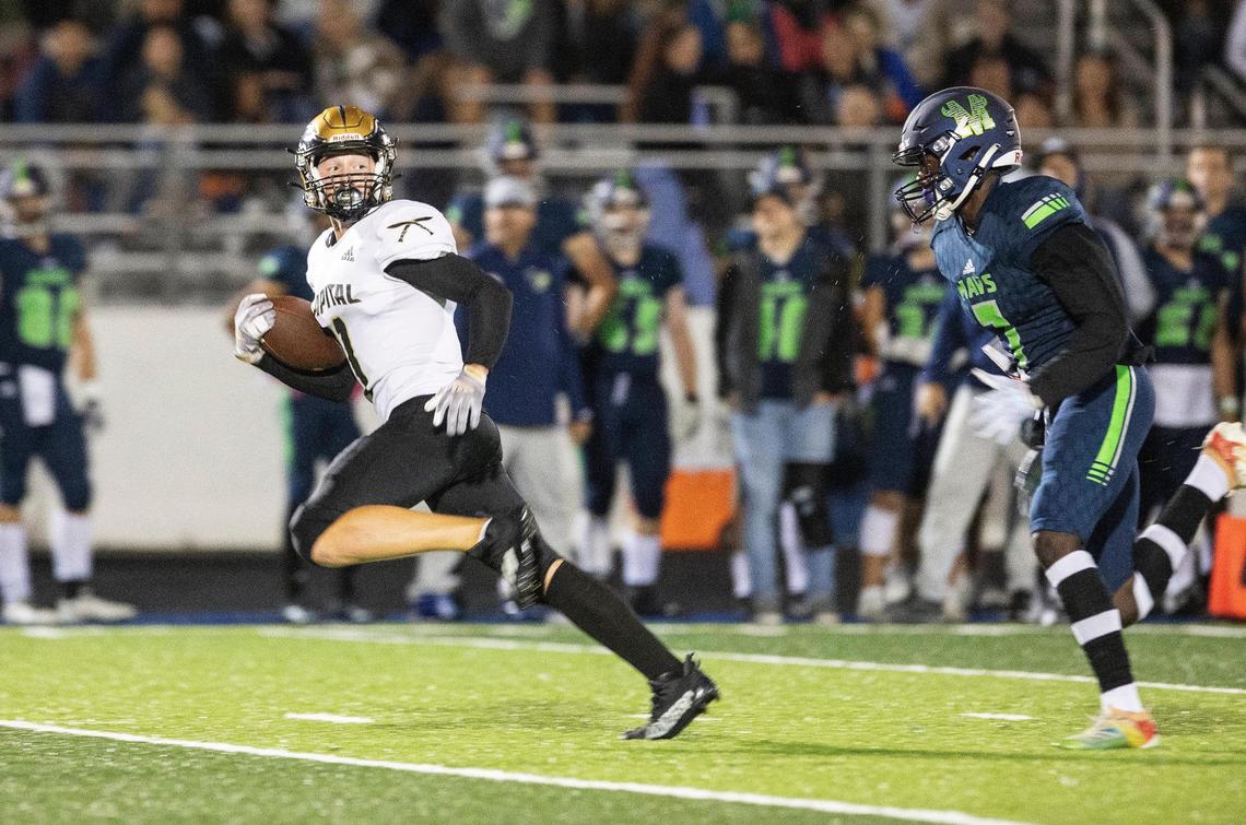Capital wide receiver Avery Downey breaks free for a 52-yard touchdown on fourth-and-5 as Mountain View defensive back Alameen Abimbola trails behind him on Friday evening.