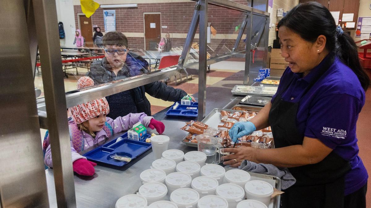 Siena Elementary School nutrition manager Hokali Borda cooks oatmeal for student breakfasts.