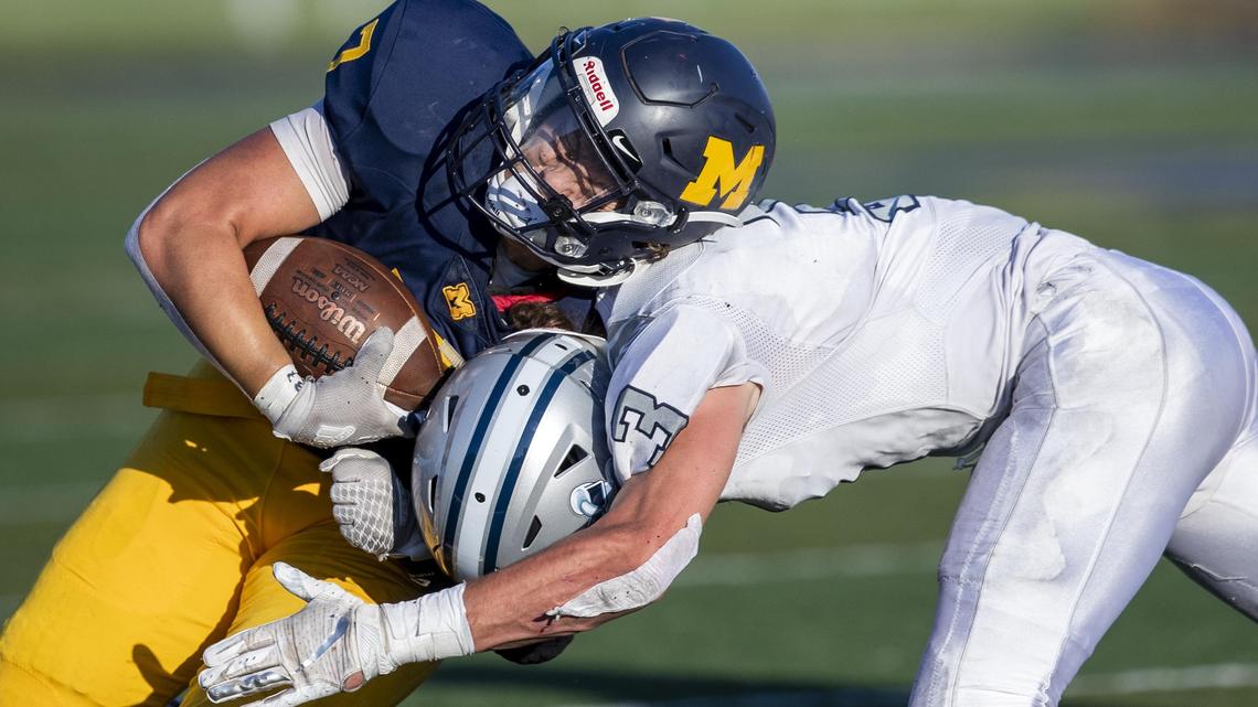 Meridian running back Chase Black, who rushed for 106 yards and two TDs, takes a hit from Skyview’s Dan Castledine on a first-down run Friday night at Meridian High School.