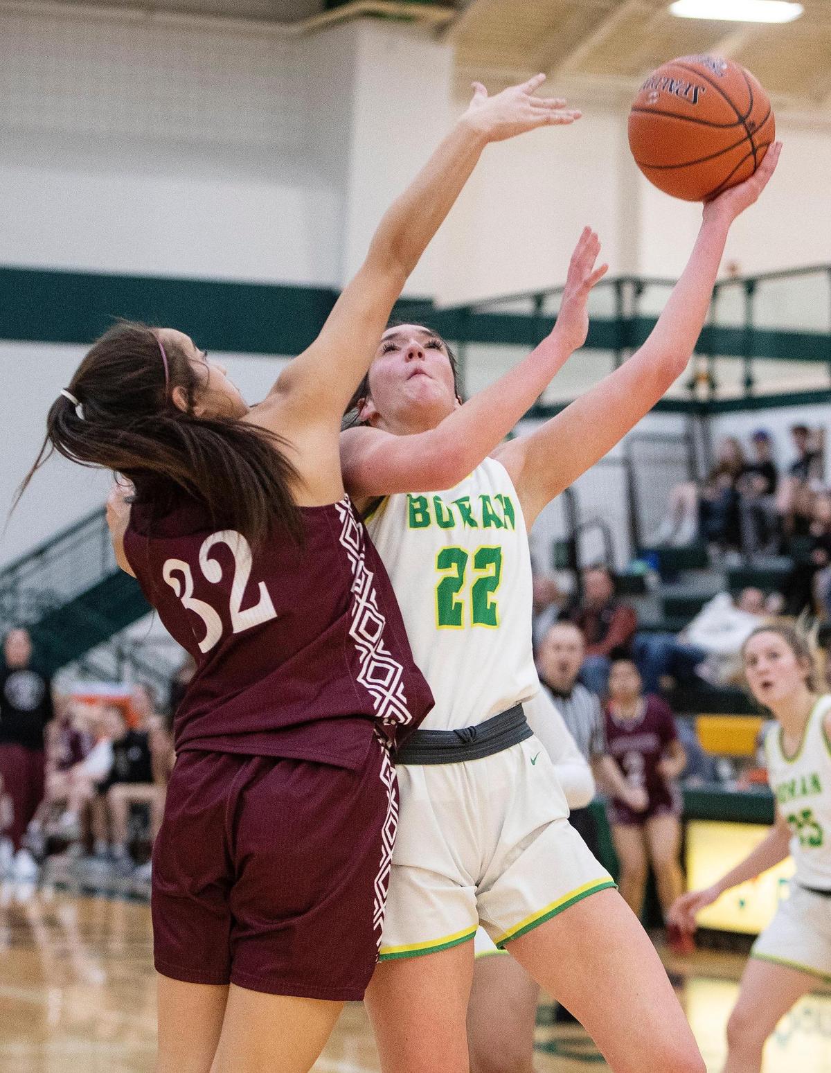 Borah sophomore Sydnie Rodriguez, right, rises for a shot over Centennial freshman Eliana Ti’a and scored 28 points in a 65-48 win Friday. 