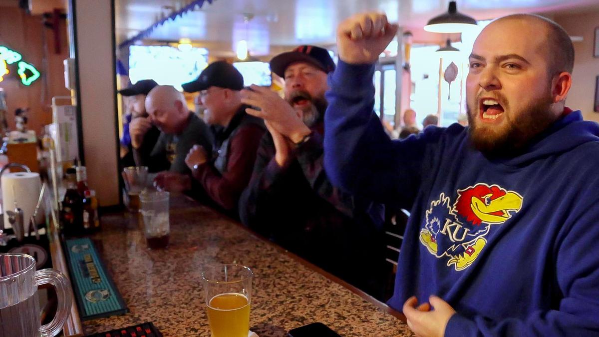 Bryan Sholtz, right, and Rollie Fletcher, cheer as Kansas scores against North Carolina in the NCAA Final Four championship game Monday, April 4, 2022, at Hyde Park Bar & Grill in Boise’s North End. The sports bar was voted by readers as the best locally owned venue to watch the tournament during a weeks-long, head-to-head tournament style voting on the Idaho Statesman website.