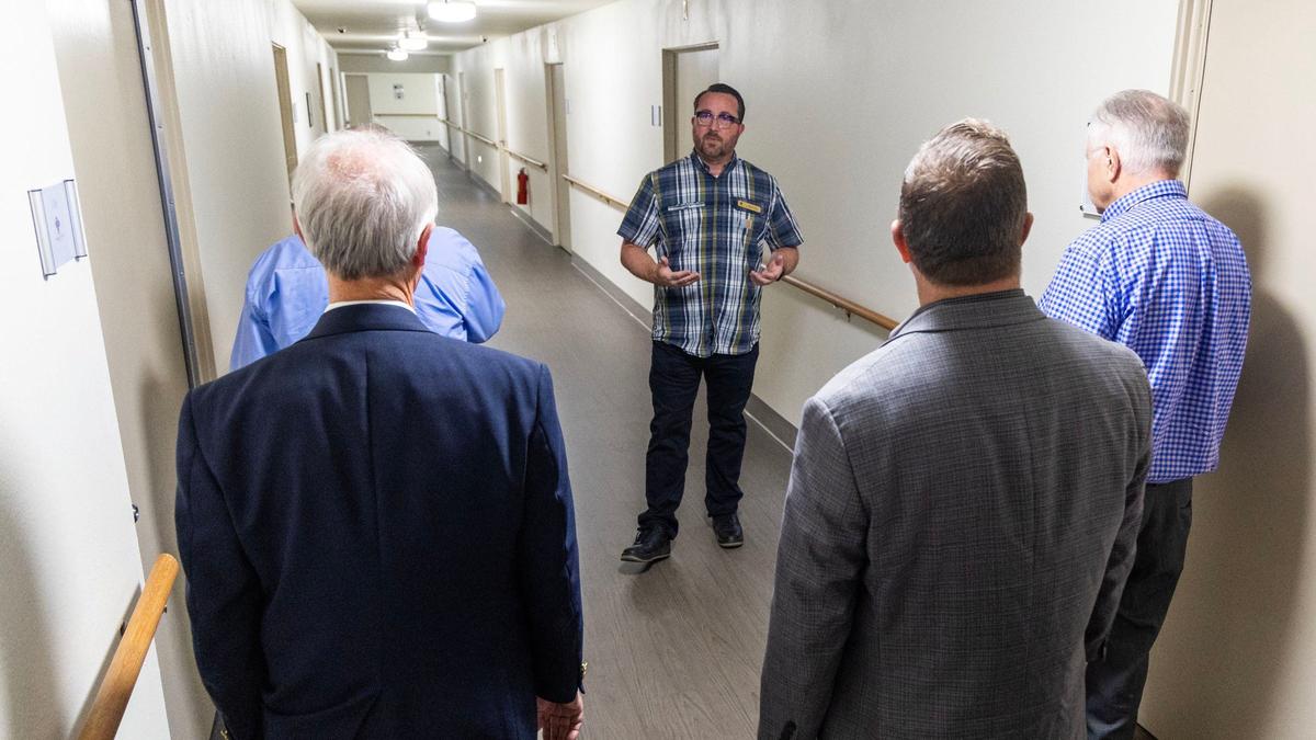 Jacob Lang, senior director of operations at the Boise Rescue Mission’s The Next Step in Boise, describes the transitional living environment for residents as Ada County commissioners tour the 55,000-square-foot, 58-apartment residence at 1777 S. Curtis Road.