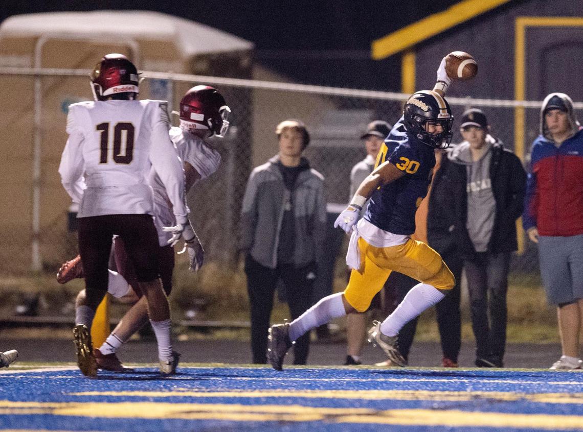Meridian running back Rylie Byington scores one of his two touchdowns Friday in the 5A state semifinals.