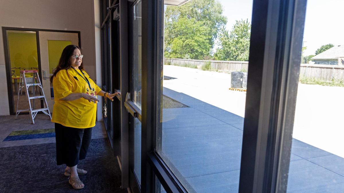 Cori Norton, Kuna unit director for the Boys & Girls Clubs of Ada County, points out where a patio area and greenhouse will be added for kids to enjoy the outdoors at the club’s new facility.