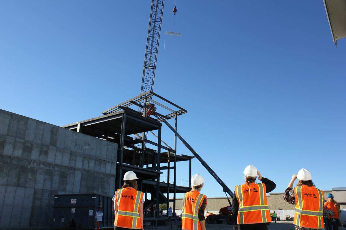 Workers raise one of the final beams on St. Luke’s Nampa Medical Center’s new cancer center.