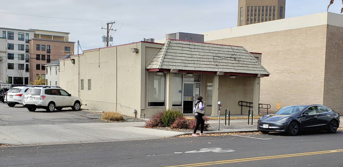 The three-story building planned at 505 W. Bannock St. would replace this 1945 building, a former Wells Fargo bank branch.