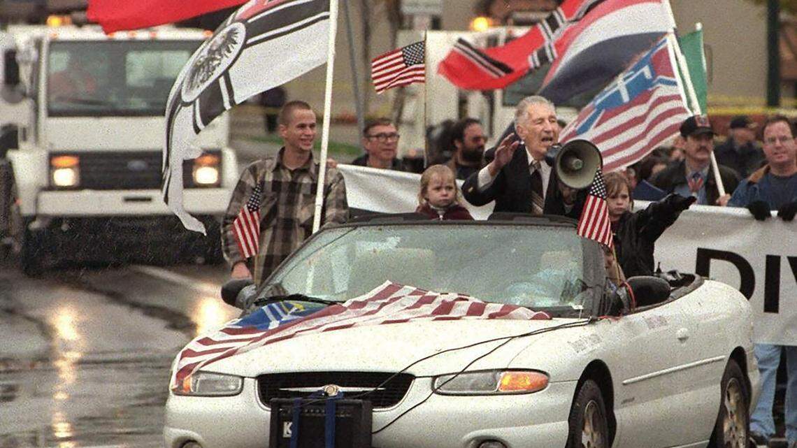 In this Oct. 28, 2000 file photo, white supremacist Richard Butler speaks through a megaphone at an Aryan Nations rally in Coeur d’Alene, Idaho. The Aryan Nations is long gone from northern Idaho, but its reputation lingers to the chagrin of locals.