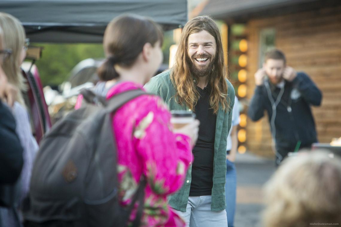 Dan Price, CEO of Gravity Payments, chats with employees during a celebration opening Gravity Payments’ new Boise office in 2019.
