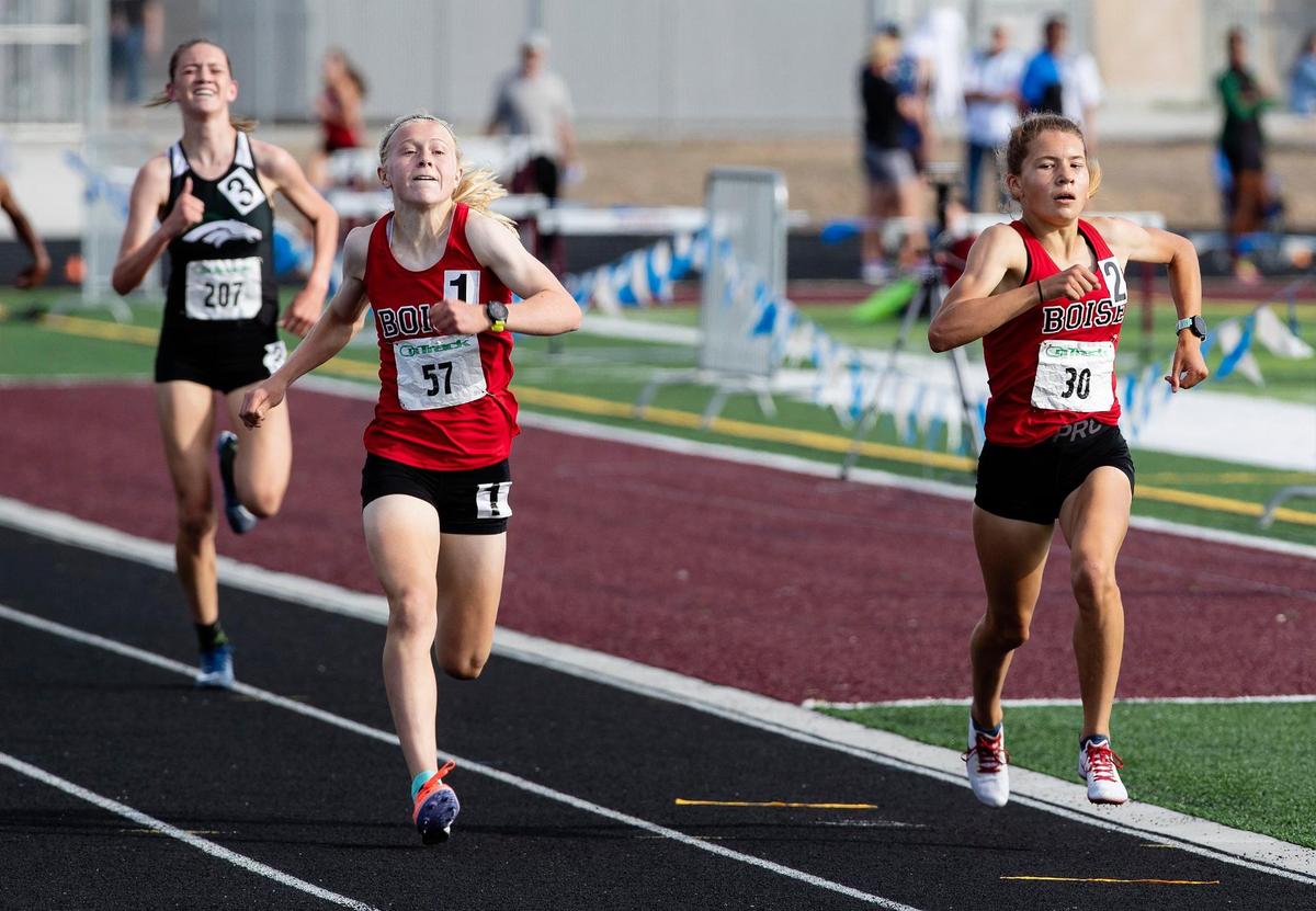 Boise High’s Sammy Smith, left, edges teammate Allie Bruce for the 1,600-meter title at the 5A District Three meet at Centennial last season. The two sophomores return as two of the state’s top long-distance runners.