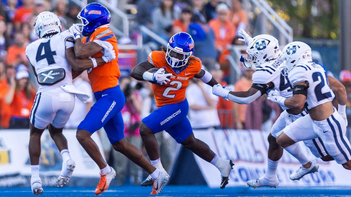 Boise State running back Ashton Jeanty breaks through the Utah State defense on his way to a 63-yard touchdown run.