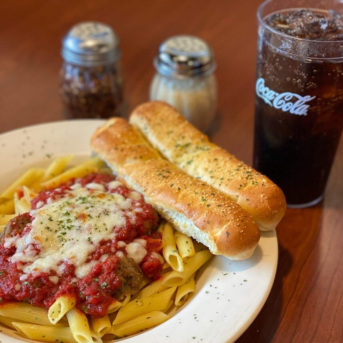 In addition to pizza, Chicago Connection offers other menu items such as baked pasta.