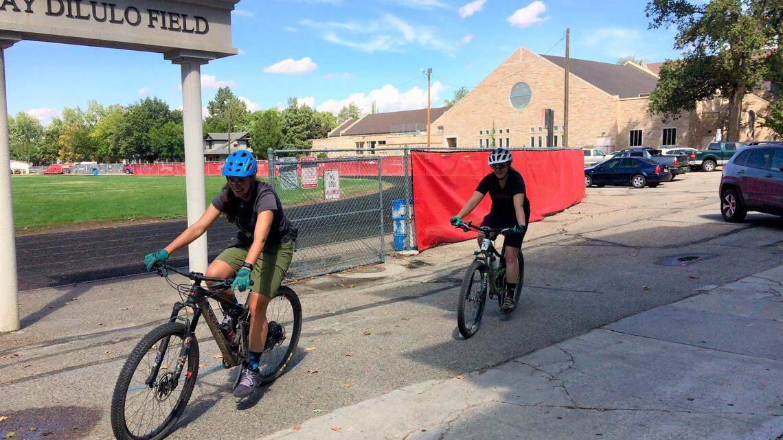 Bicyclists cut through the Boise High School campus in September on pavement and a sidewalk where the Ada County Highway District plans a portion of its “low-stress” bikeway along 11th Street from Heron Street on the North End south to State Street.