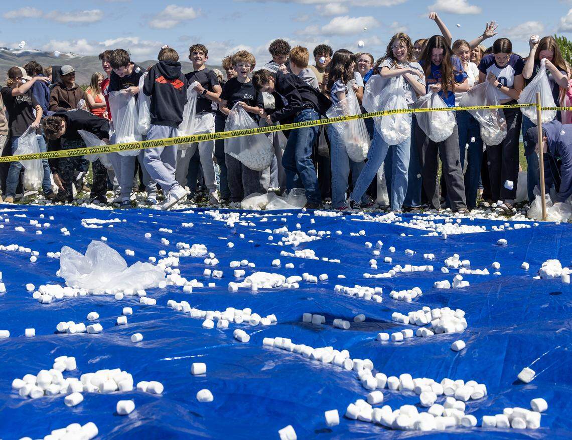 Students at Les Bois Junior High School attempt to break the world record for the largest marshmallow battle, Friday, April 17, 2026. The student body threw 2270 pounds, or approximately 145,000 marshmallows at each other on a makeshift battlefield behind the school.