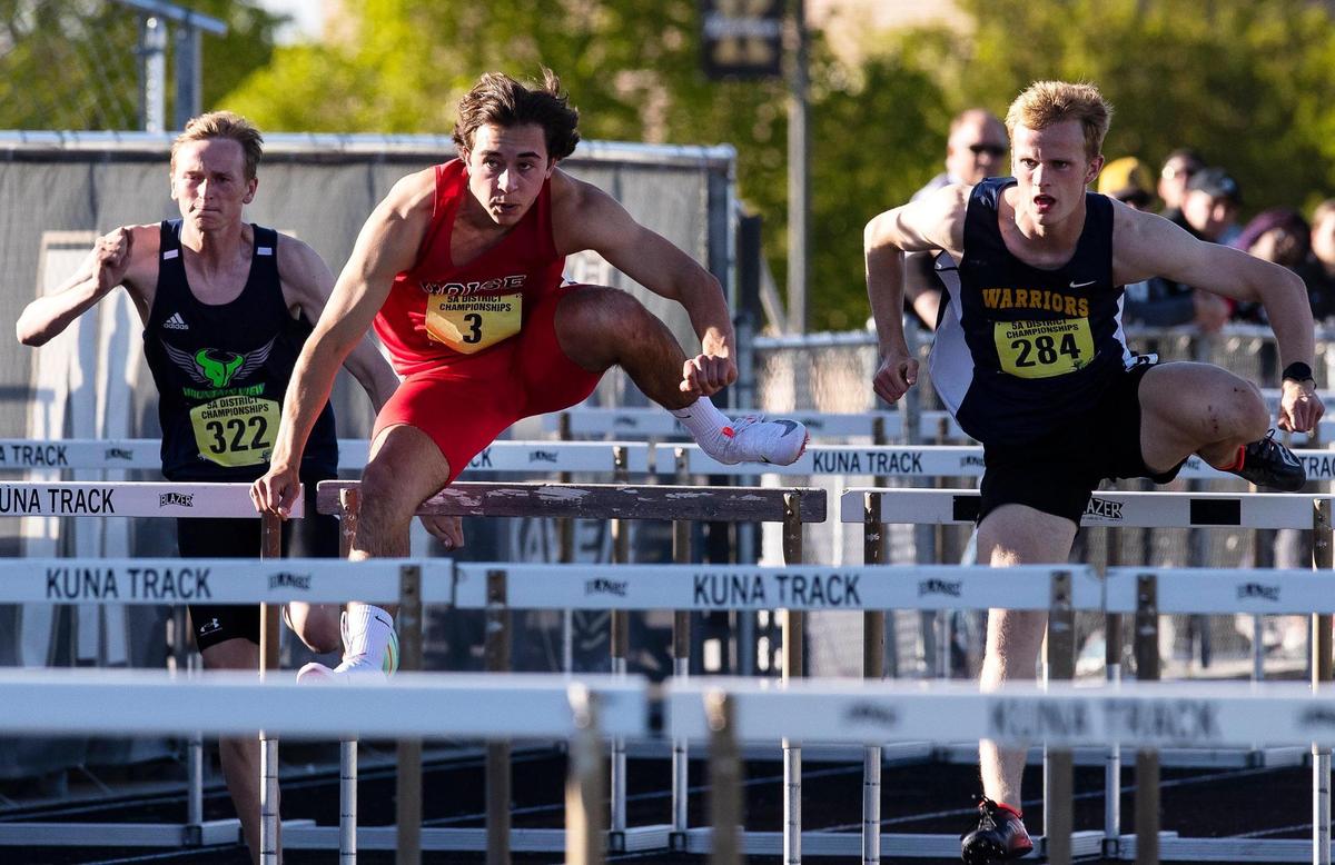 Boys compete in 110 hurdles during the 5A District Three track and field championships held at Kuna High School on Friday.