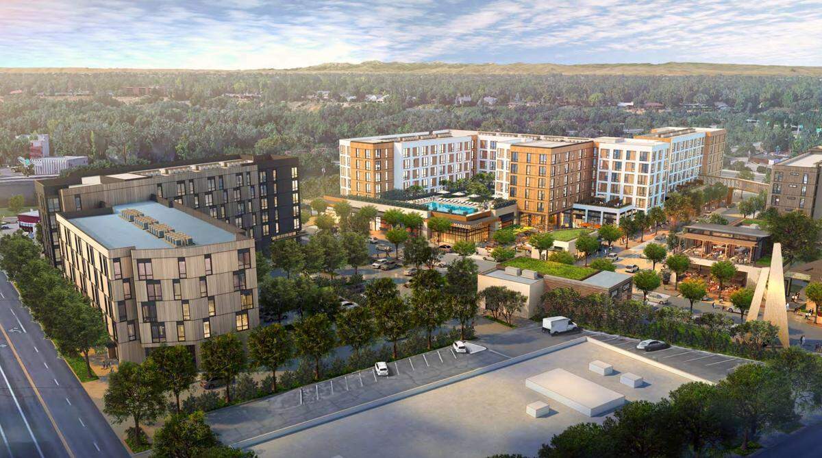 An artist’s rendering of a proposed mixed-use project at the corner of Whitewater Park Boulevard and Main Street. Boise developer Roundhouse plans to build 400 apartments and 15,000 square feet of retail space.