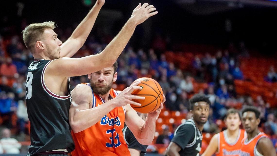 Boise State forward Mladen Armus fights for position and scores on Santa Clara forward Josip Vrankic in the first half Tuesday, Dec. 14, 2021, at ExtraMile Arena in Boise.