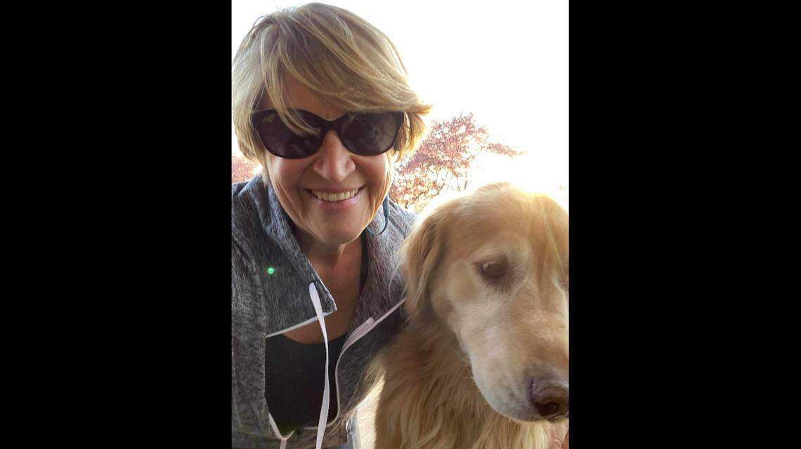 Barbara Anderson with her 11-year-old golden retriever, Bella, whom Anderson had to give up when she moved into a studio apartment in Boise.