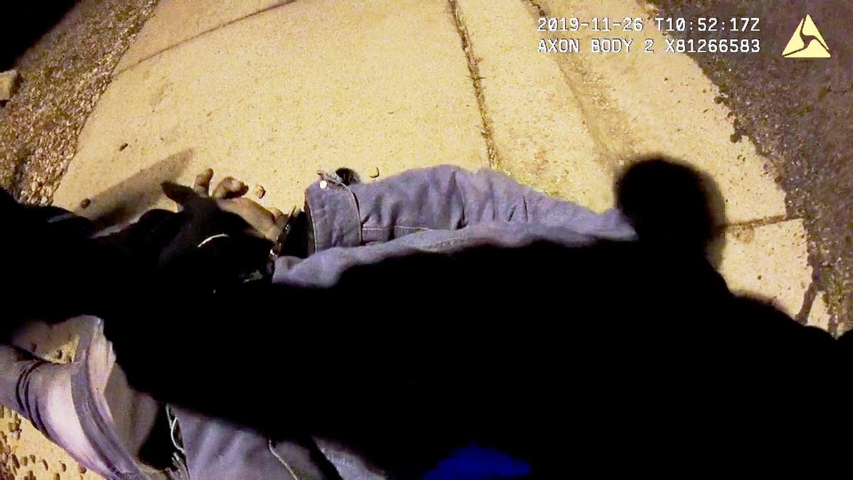 Boise Police body-cam video of an arrest on Nov. 26, 2019, shows a 17-year-old Black youth on the sidewalk in handcuffs shortly after police officer Tyson Cooper threw him onto the ground.