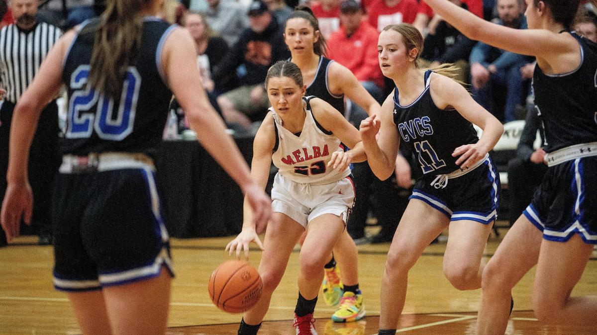 Cole Valley Christian defenders surround Melba sophomore Brooklynn Dayley in the second half of their 2A girls basketball state semifinal game at Kuna High School on Friday. Cole Valley won to reach the title game.