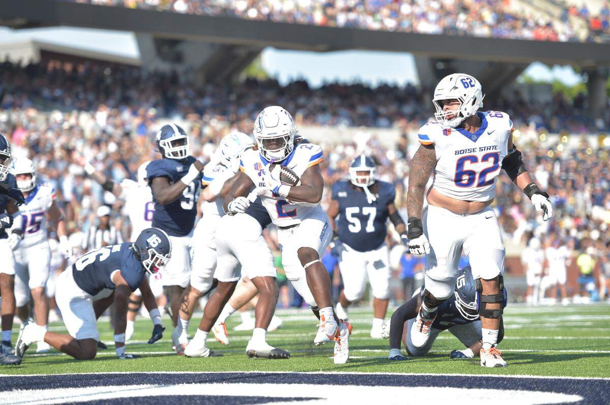 Right guard Roger Carreon, right, and the rest of Boise State’s offensive line helped the Broncos average a school-record 10.6 yards per carry in a 56-45 win Saturday at Georgia Southern.