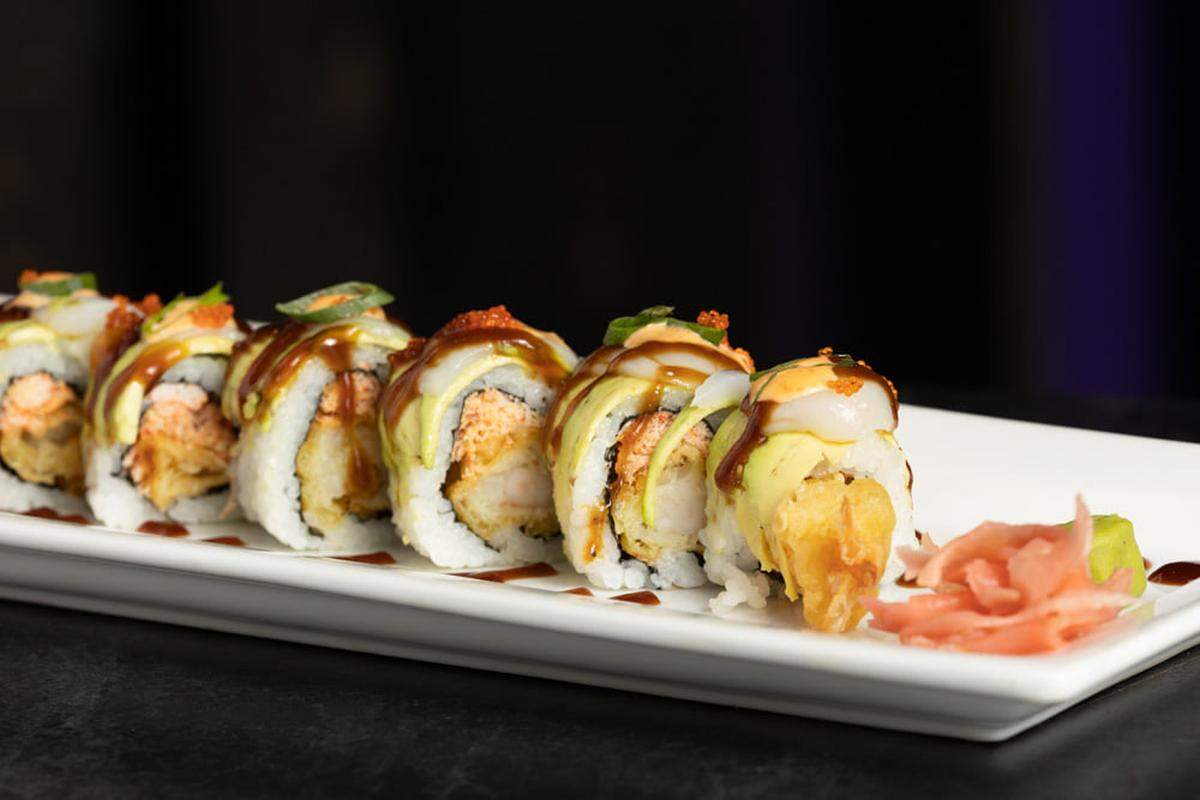 The Marilyn Monroe is one of the most popular sushi rolls. It includes snow crab, tempura shrimp, avocado, scallop and made-from-scratch sauces.