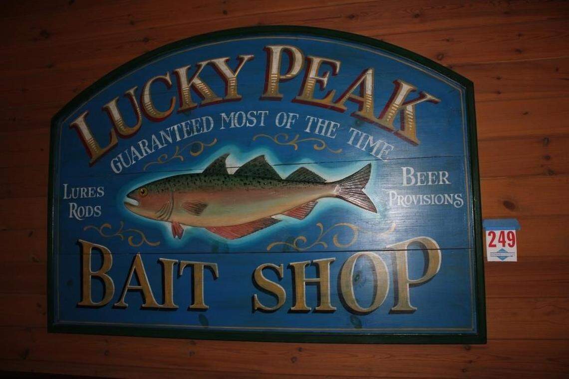 Some of the items up for auction include signs and artwork with references to Boise and Idaho.