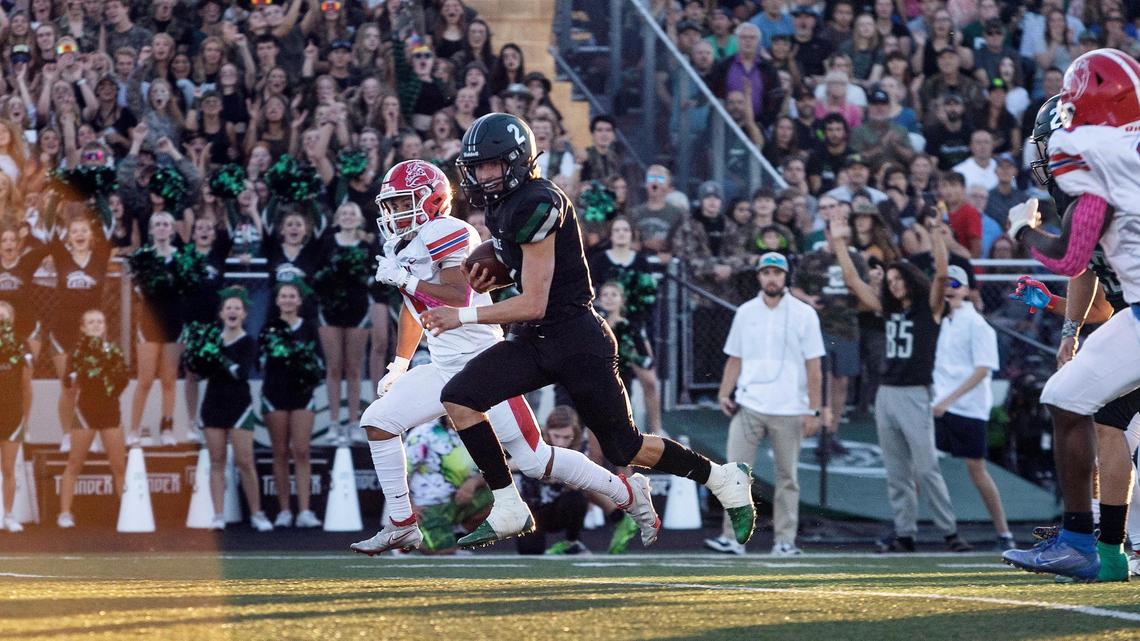 Eagle quarterback Jake Longson breaks free for a 47-yard touchdown run in the first quarter Friday against Nampa at Eagle High.