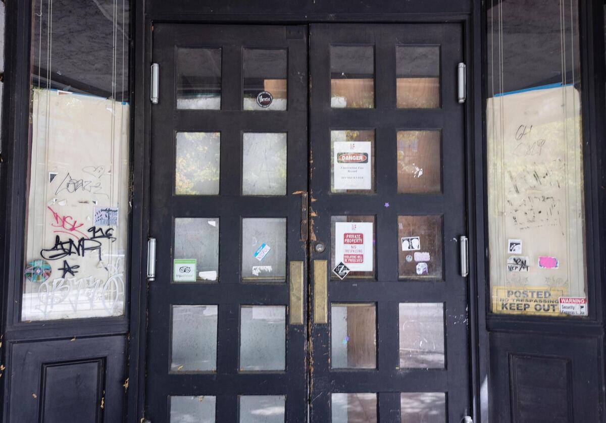 No-trespassing signs hang in the front door.